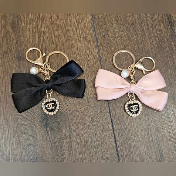 . Accessories - NEW Bow Bag Charm/ Keychain In Choice of Black or Pink Featuring Chanel Charm